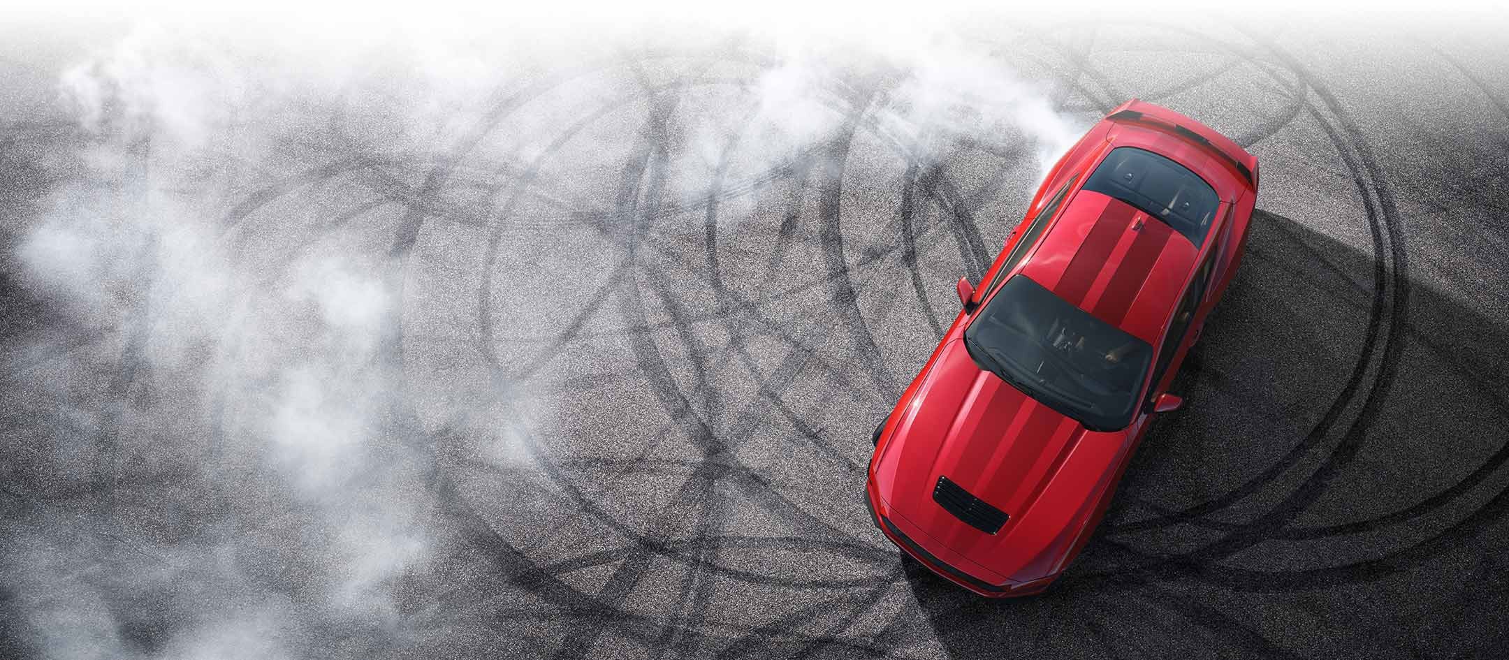 Overhead view of a 2024 Ford Mustang® model with tire tracks on pavement | Bell-McCall Company in Hamilton MT