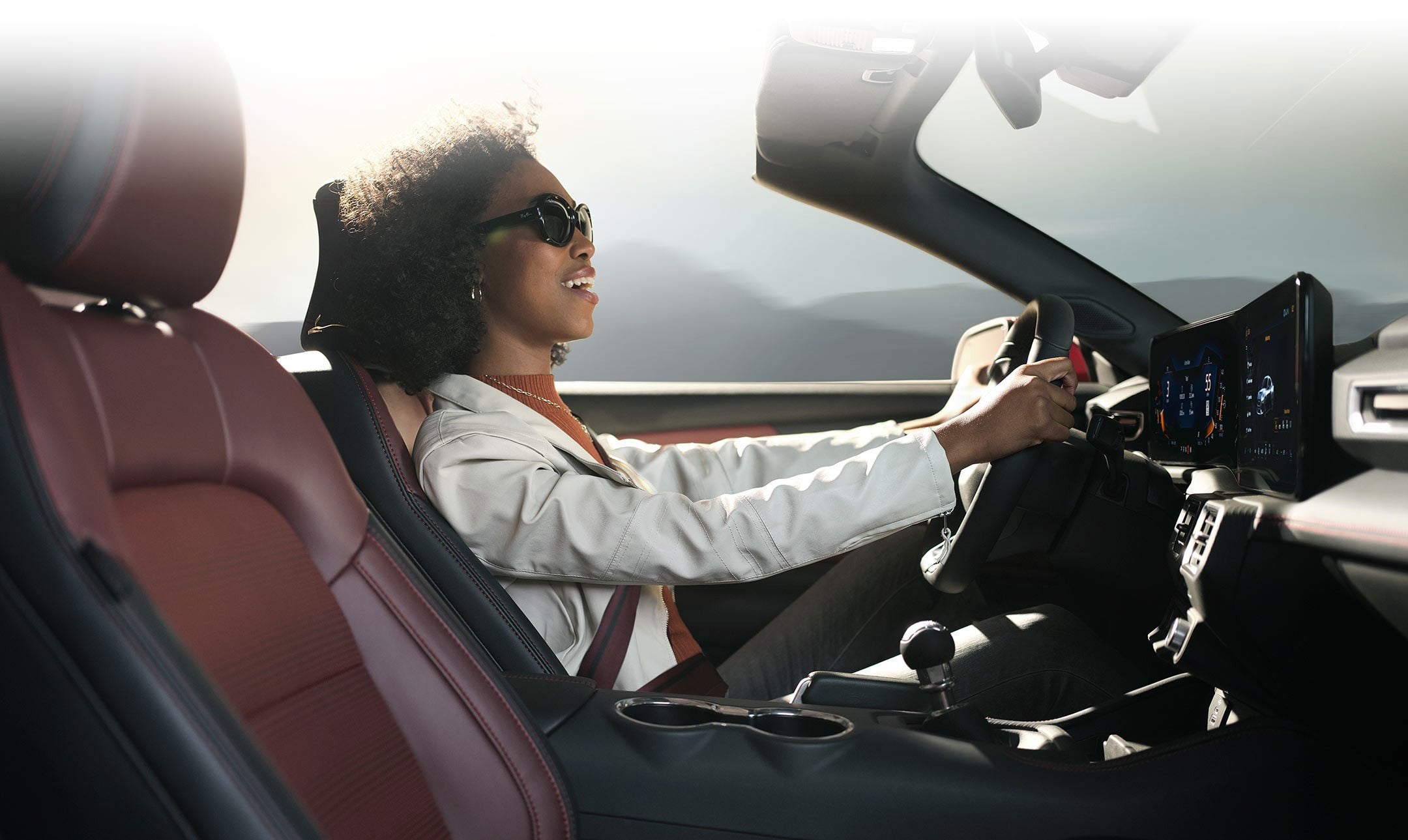 Person sitting in the driver’s seat of a 2024 Ford Mustang® convertible | Bell-McCall Company in Hamilton MT