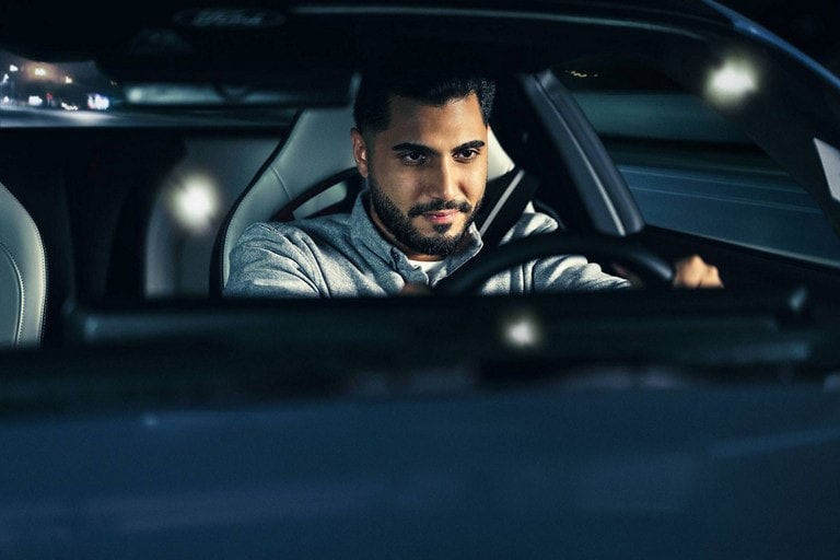 Person sitting in the driver’s seat of a parked 2024 Ford Mustang® coupe | Bell-McCall Company in Hamilton MT